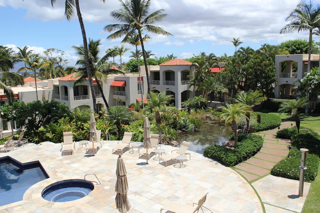 Tropical gardens and water features welcome residents at Wailea Palms